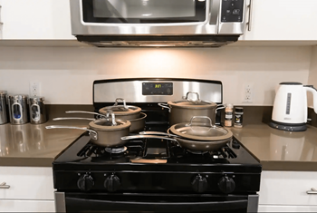 Stainless steel gas range/oven, microwave, double sinks, refrigerator with icemaker